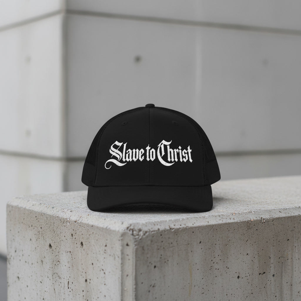 Black mesh-back trucker cap reading Slave to Christ