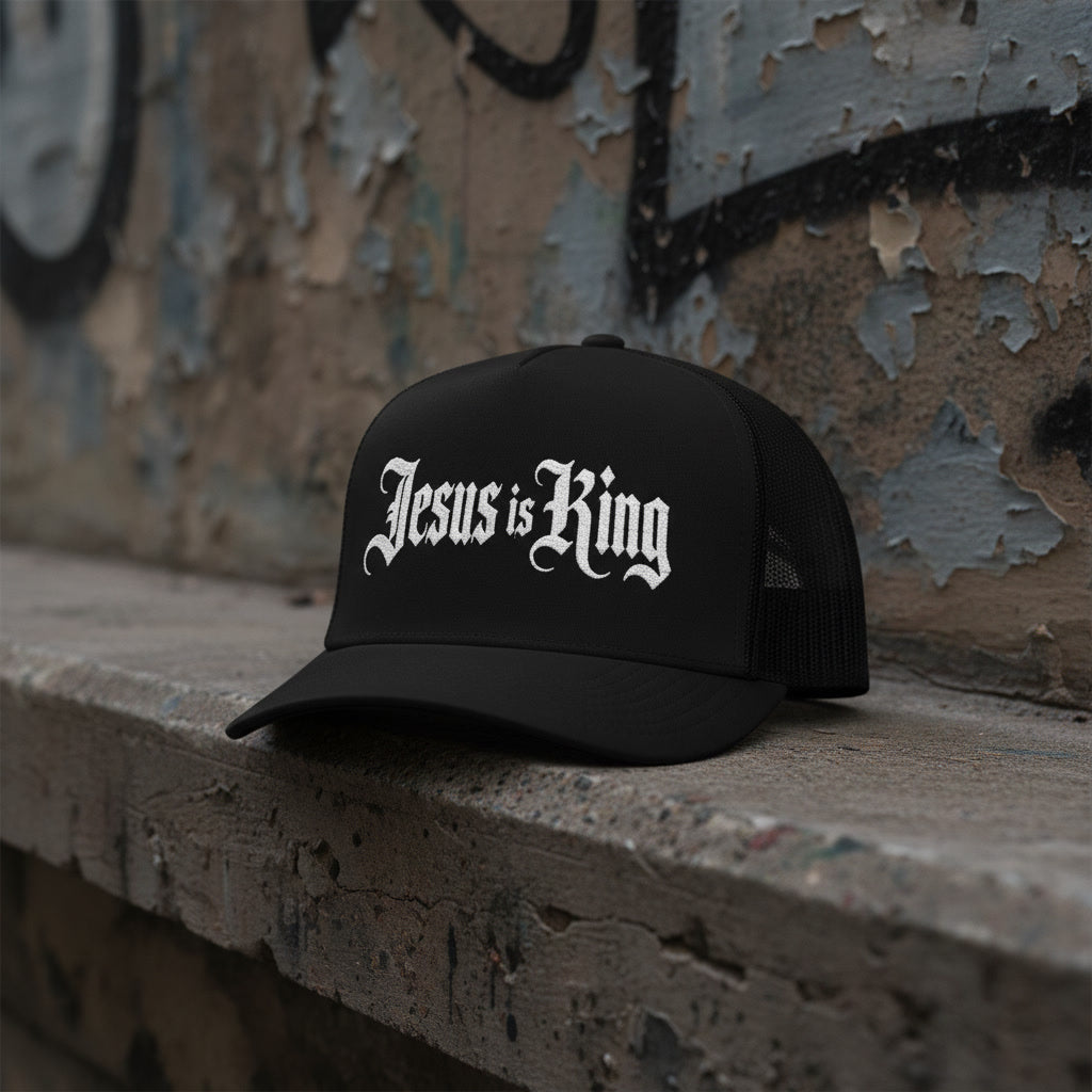 Black mesh-back trucker cap reading Jesus is King