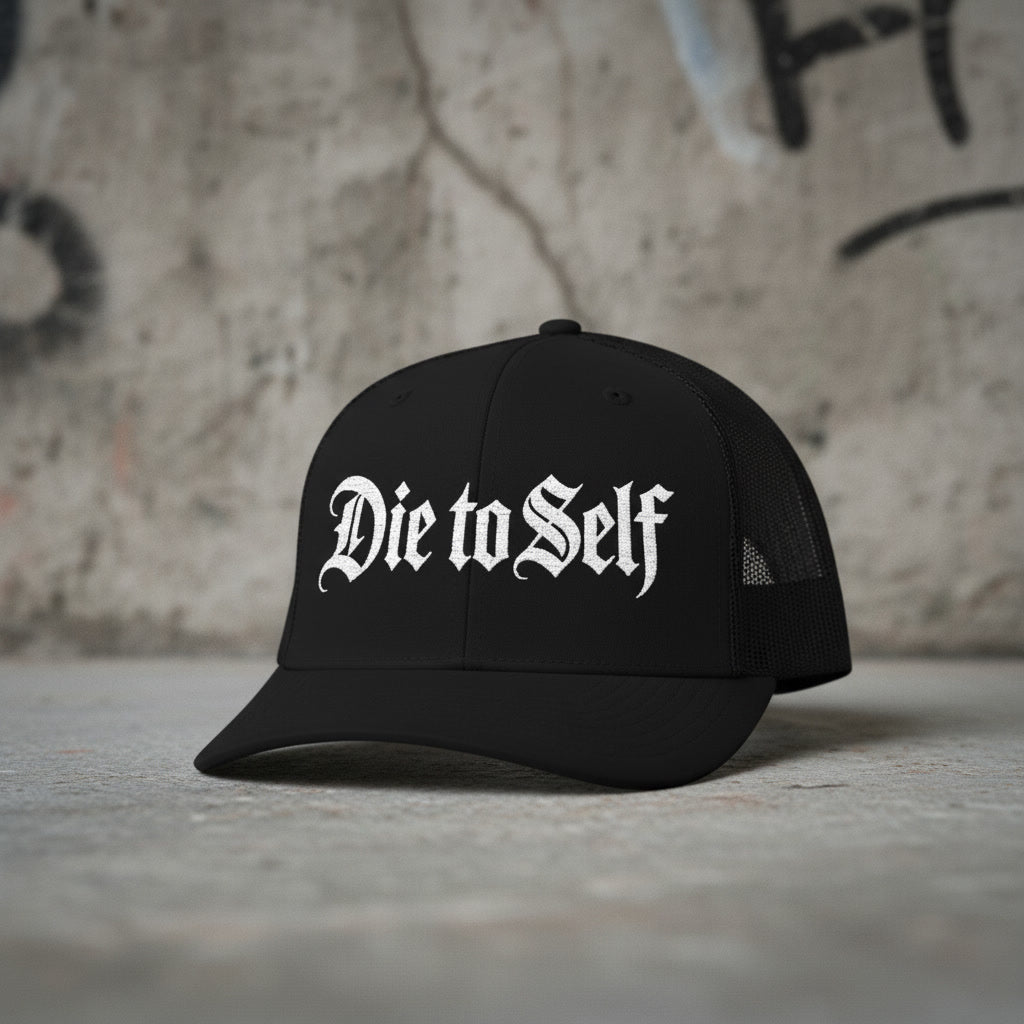 Black mesh-back trucker cap reading Die to Self