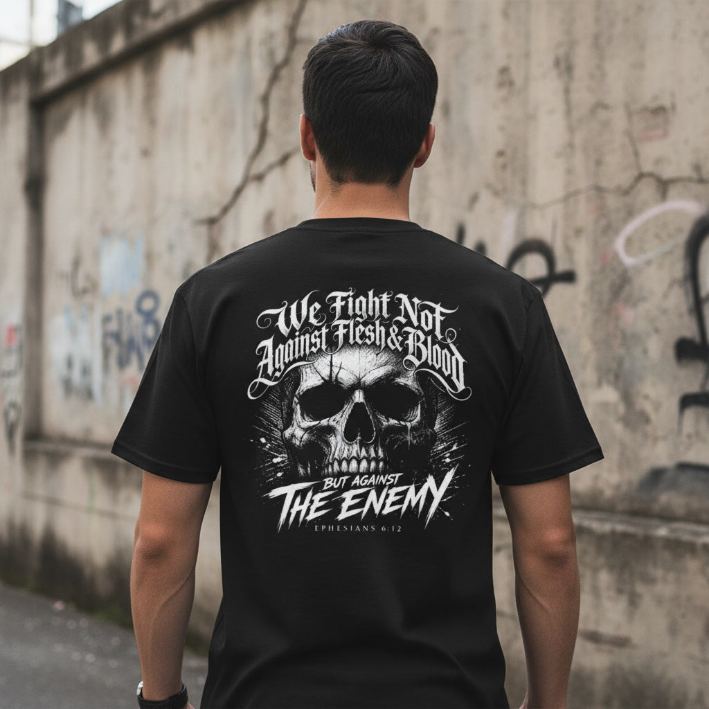 Black t-shirt showing the We Fight Not Against Flesh and Blood print in white blackletter